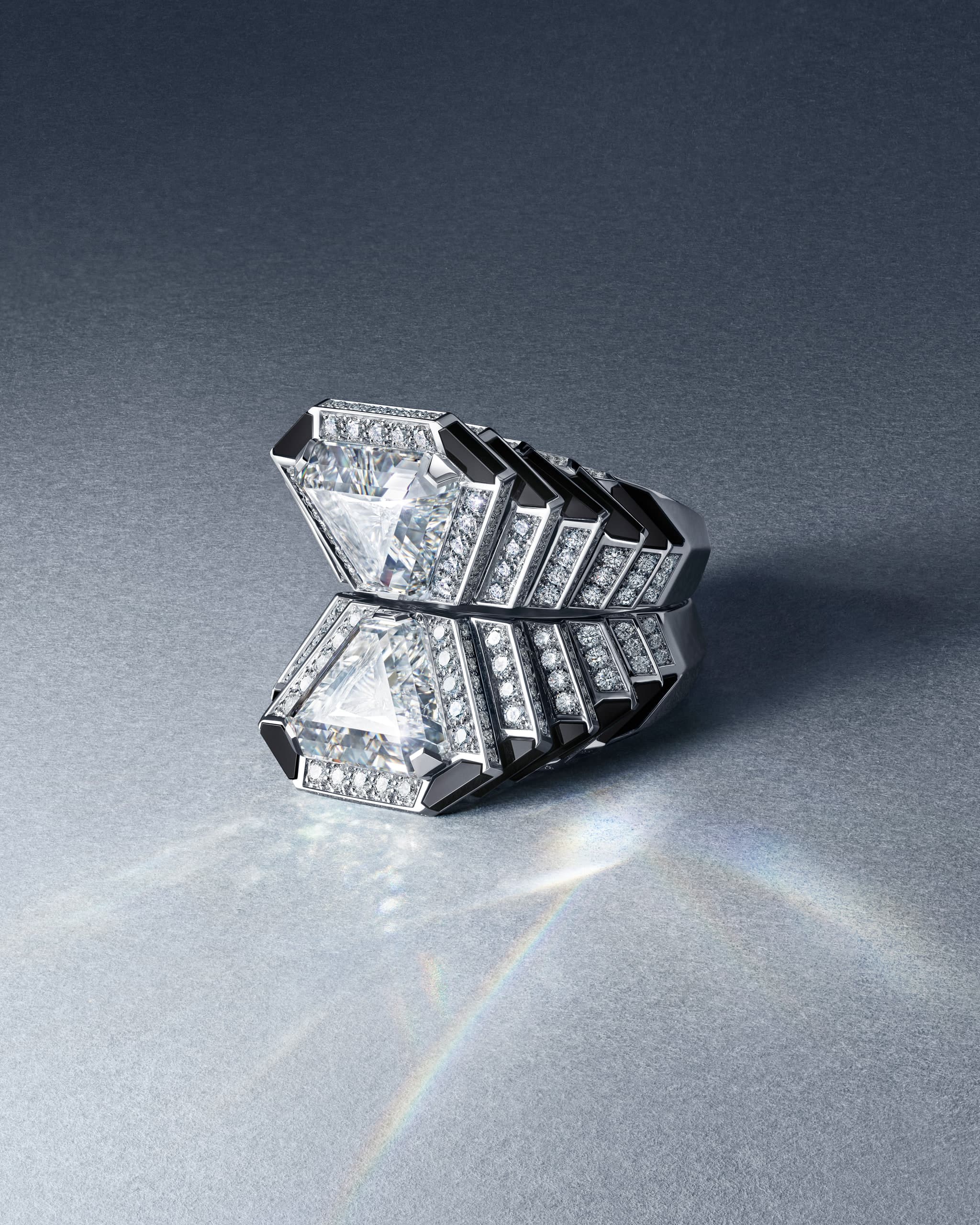 Cartier Specula modular Toi & Moi ring with two triangular diamonds on white gold against a soft studio background