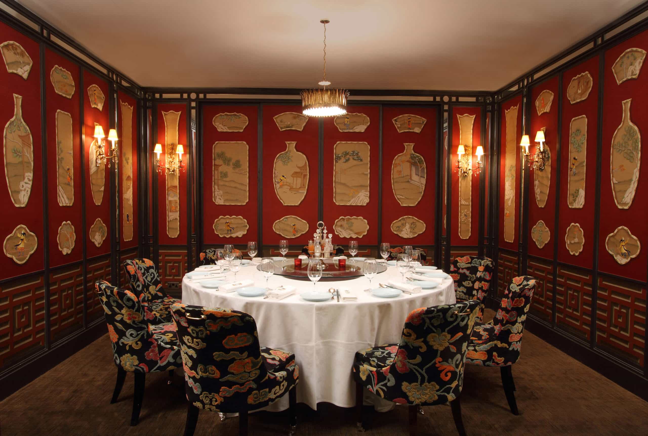 Private dining room at China Tang Landmark with round table, lazy Susan, and embroidered chairs