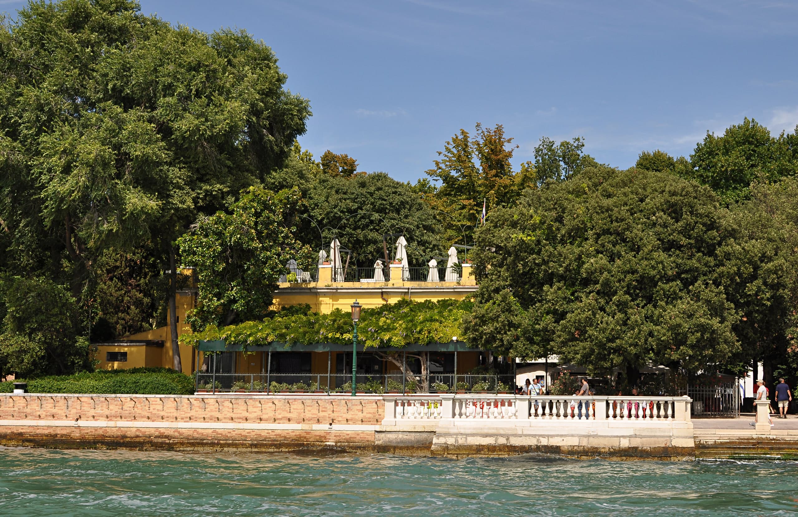 Waterfront promenade and yellow pavilion café at the Giardini della Biennale, Castello, Venice