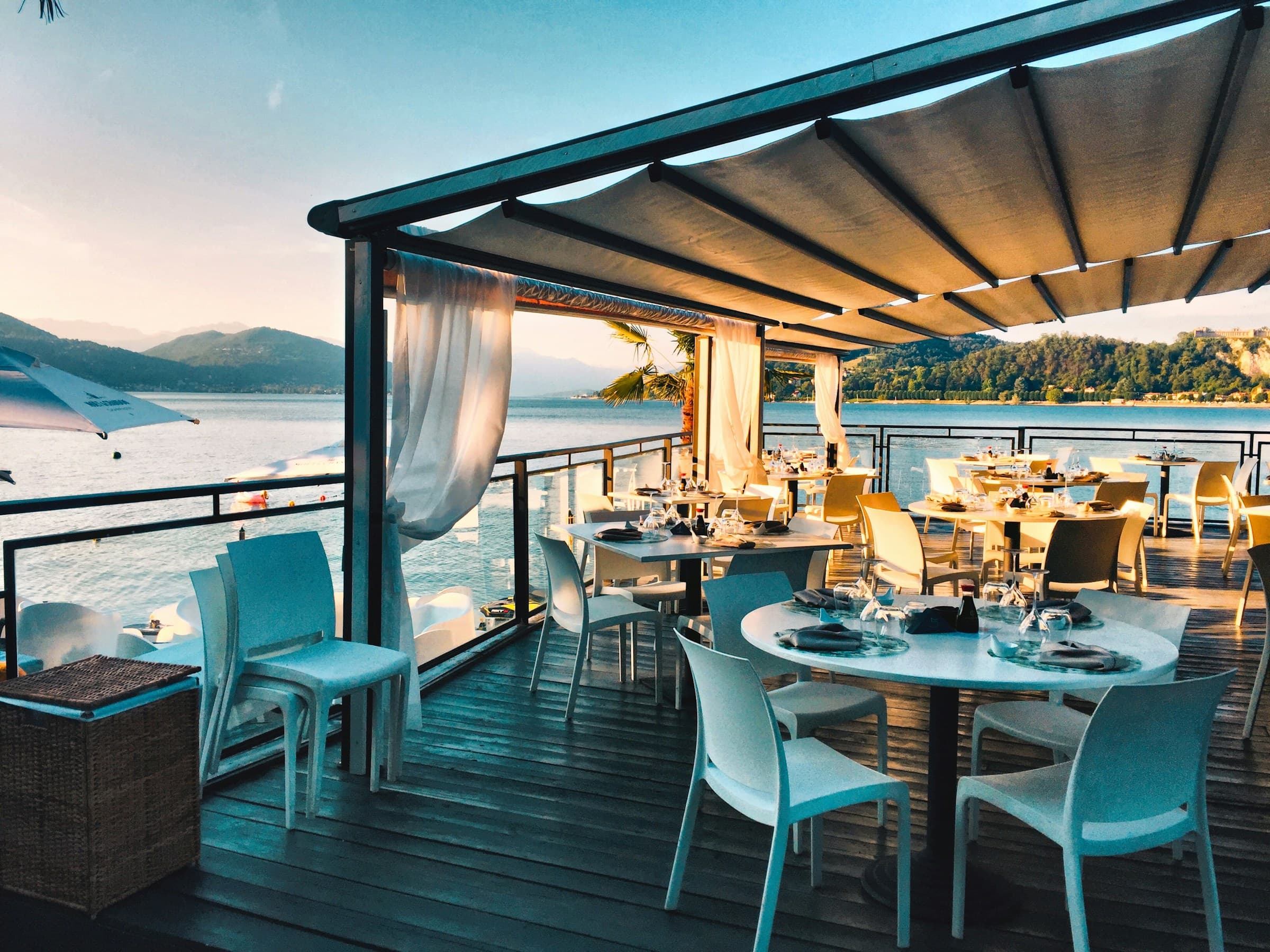 Elegant outdoor dining terrace set for service