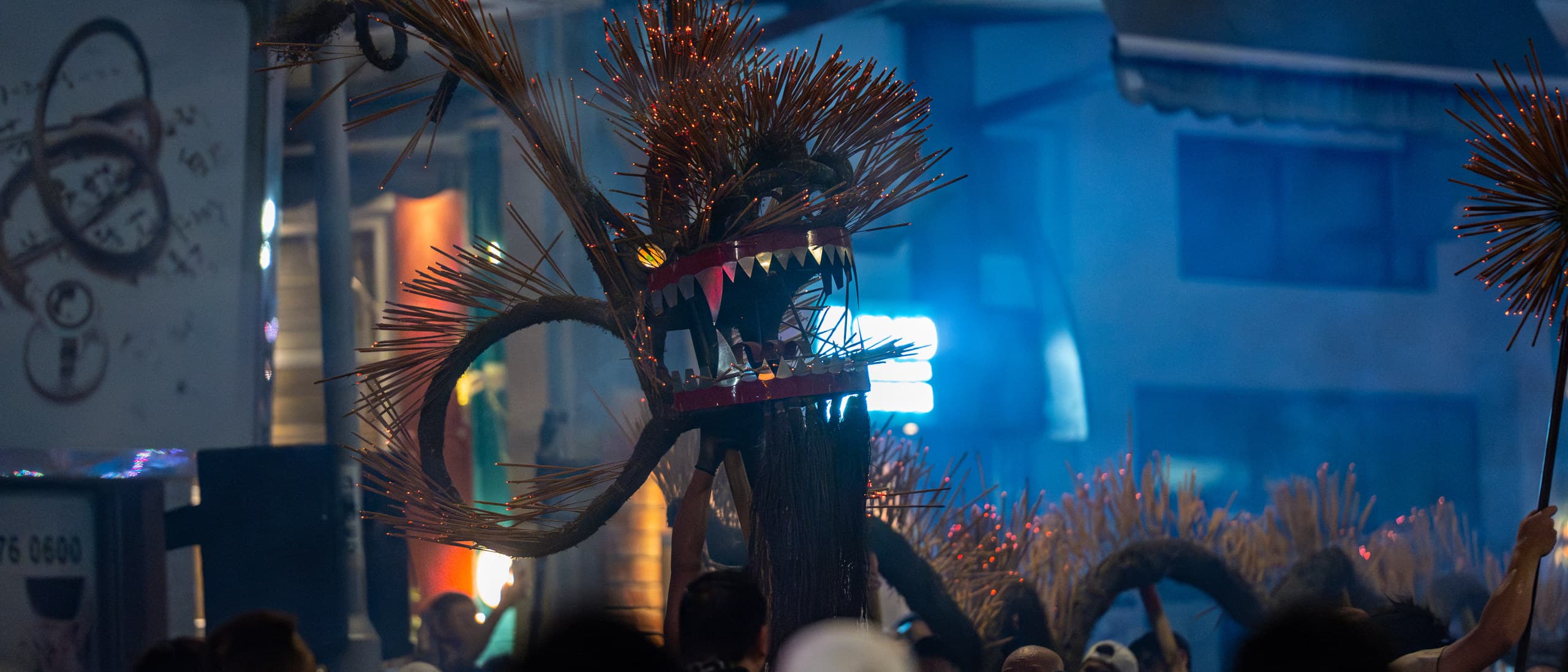Incense-studded head of the Tai Hang Fire Dragon raised above performers during Mid-Autumn Festival in Hong Kong