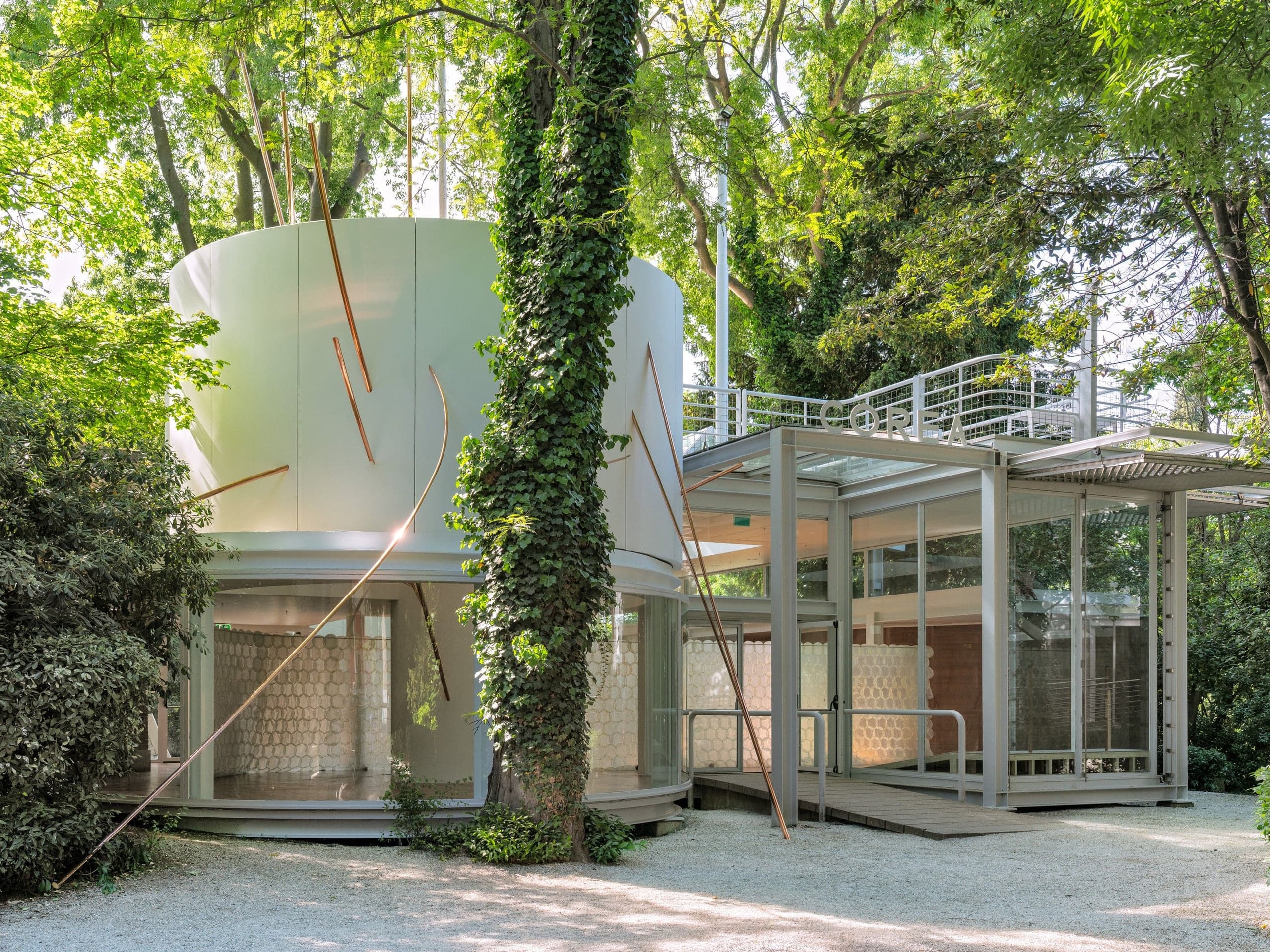Korean Pavilion exterior in the Giardini, Venice, with copper pipes from Goen Choi's Meridian