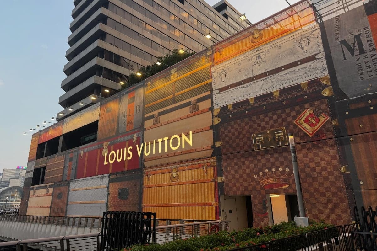A Louis Vuitton trunk hoarding wrapped around the waterfront construction site at Victoria Dockside, Tsim Sha Tsui