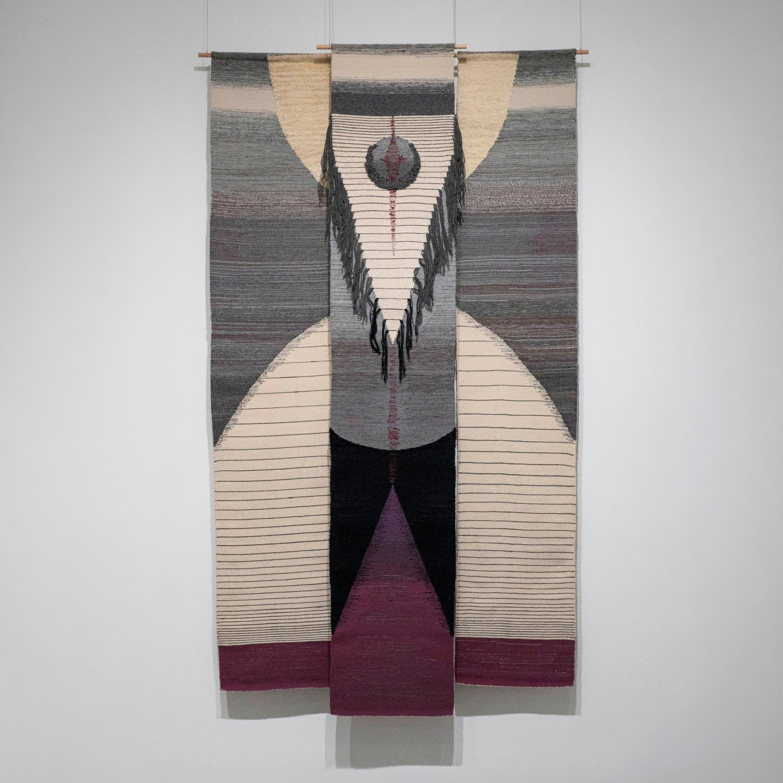 Lee ShinJa, Resurrection, 1975, a tall woven hanging with cream arcs, a dark fringed circle, and a magenta triangle