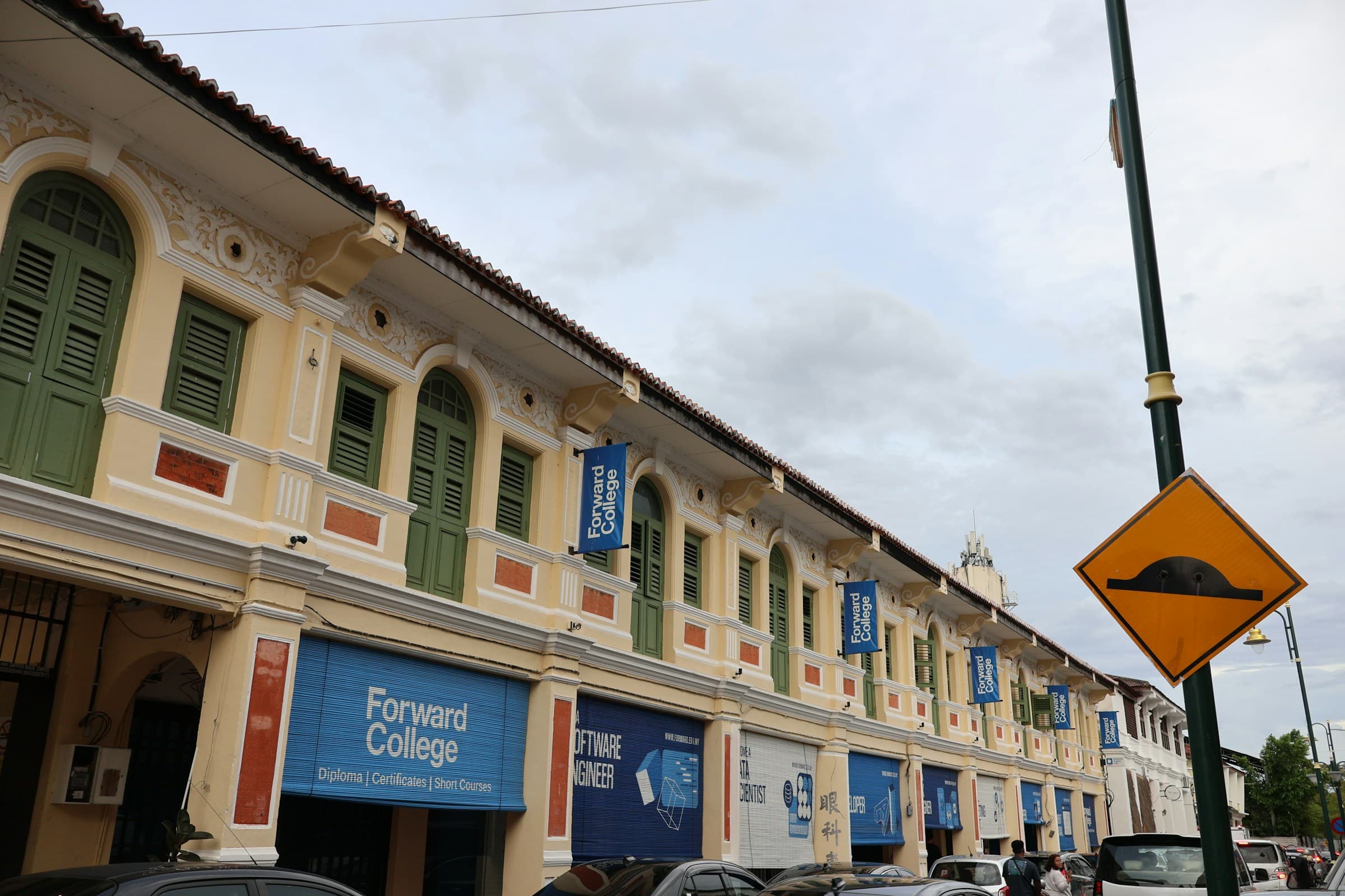 Row of heritage shophouses along a George Town street