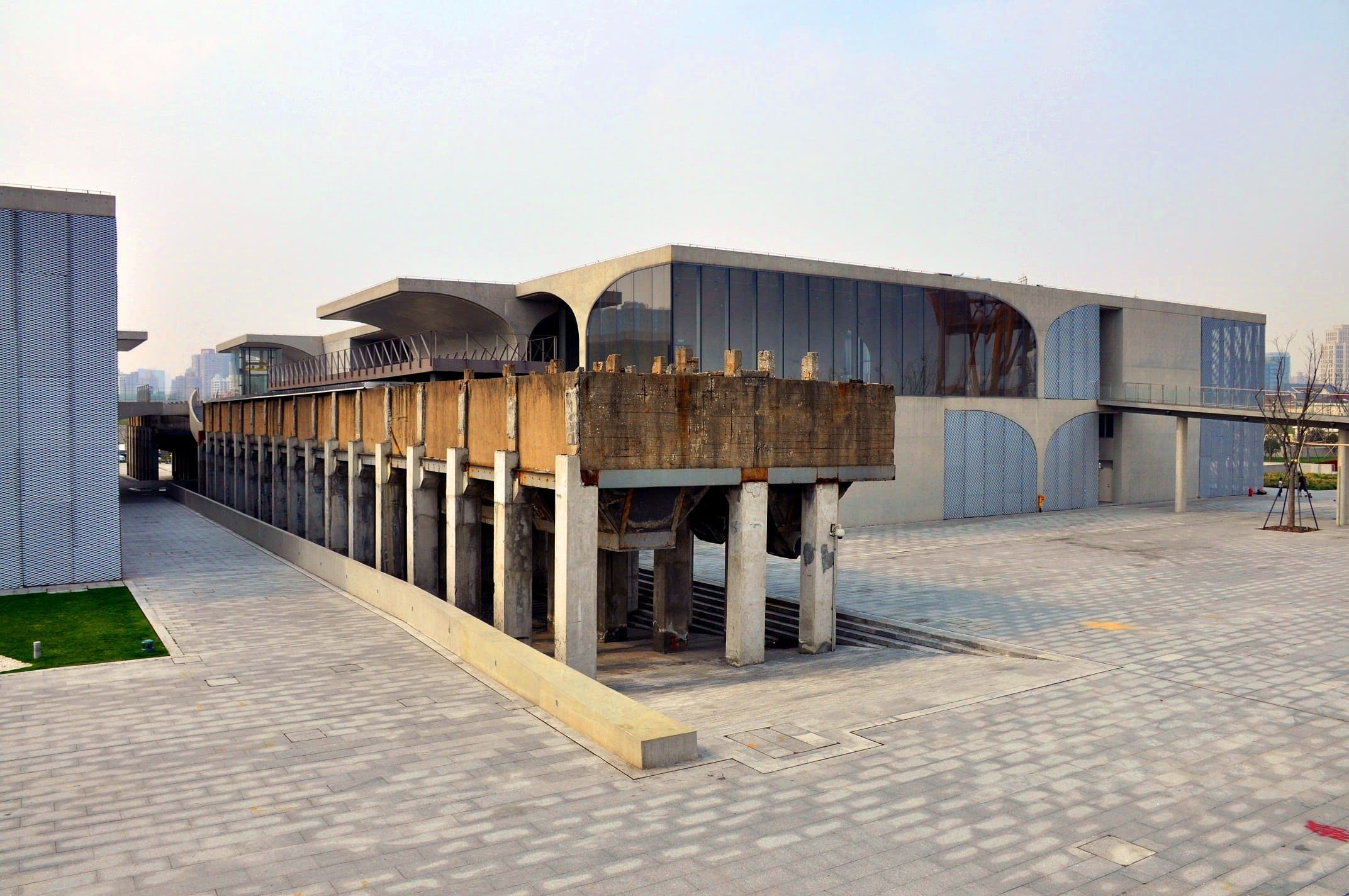 Preserved coal hopper and concrete umbrella vaults at Long Museum West Bund along Shanghai’s Huangpu riverfront
