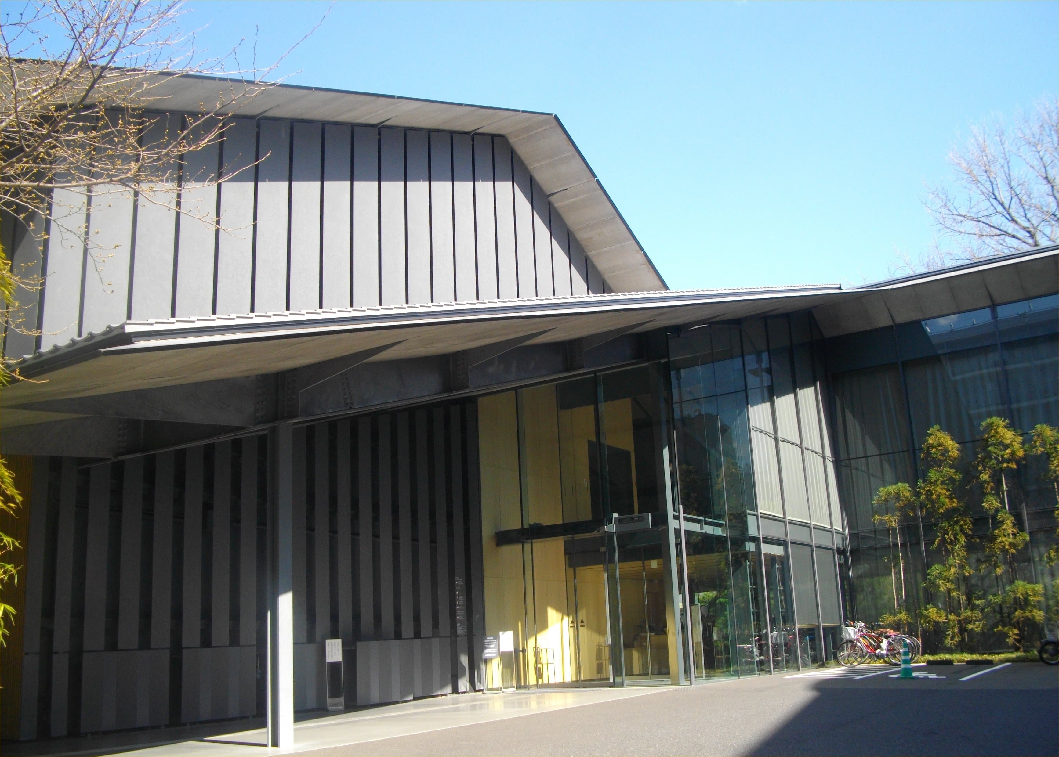 Nezu Museum entrance under deep tiled eaves with glass hall, Minami-Aoyama, Tokyo