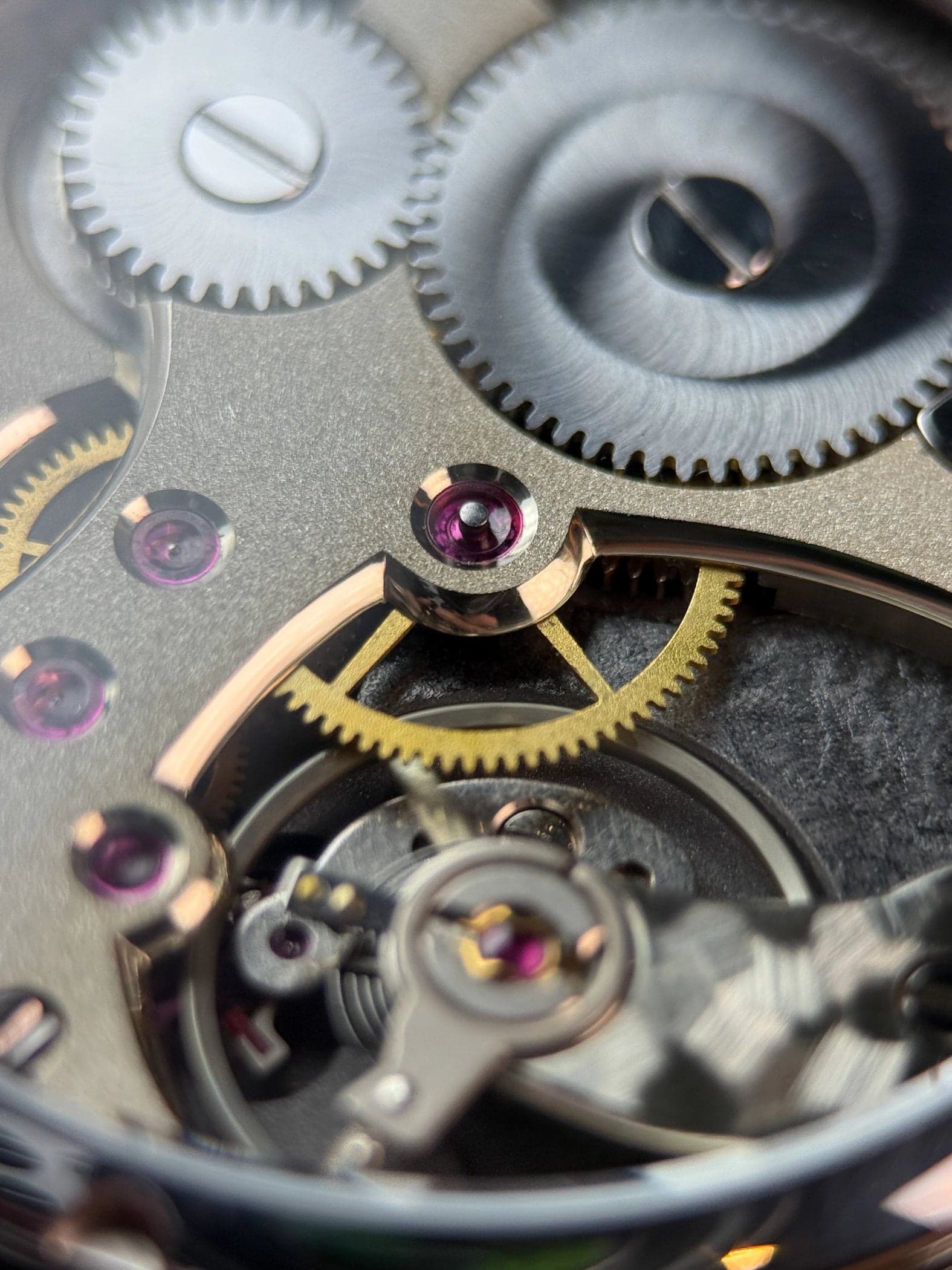 Macro of LOTH Watch 1 German-silver bridges with hand-applied anglage and pink jewels