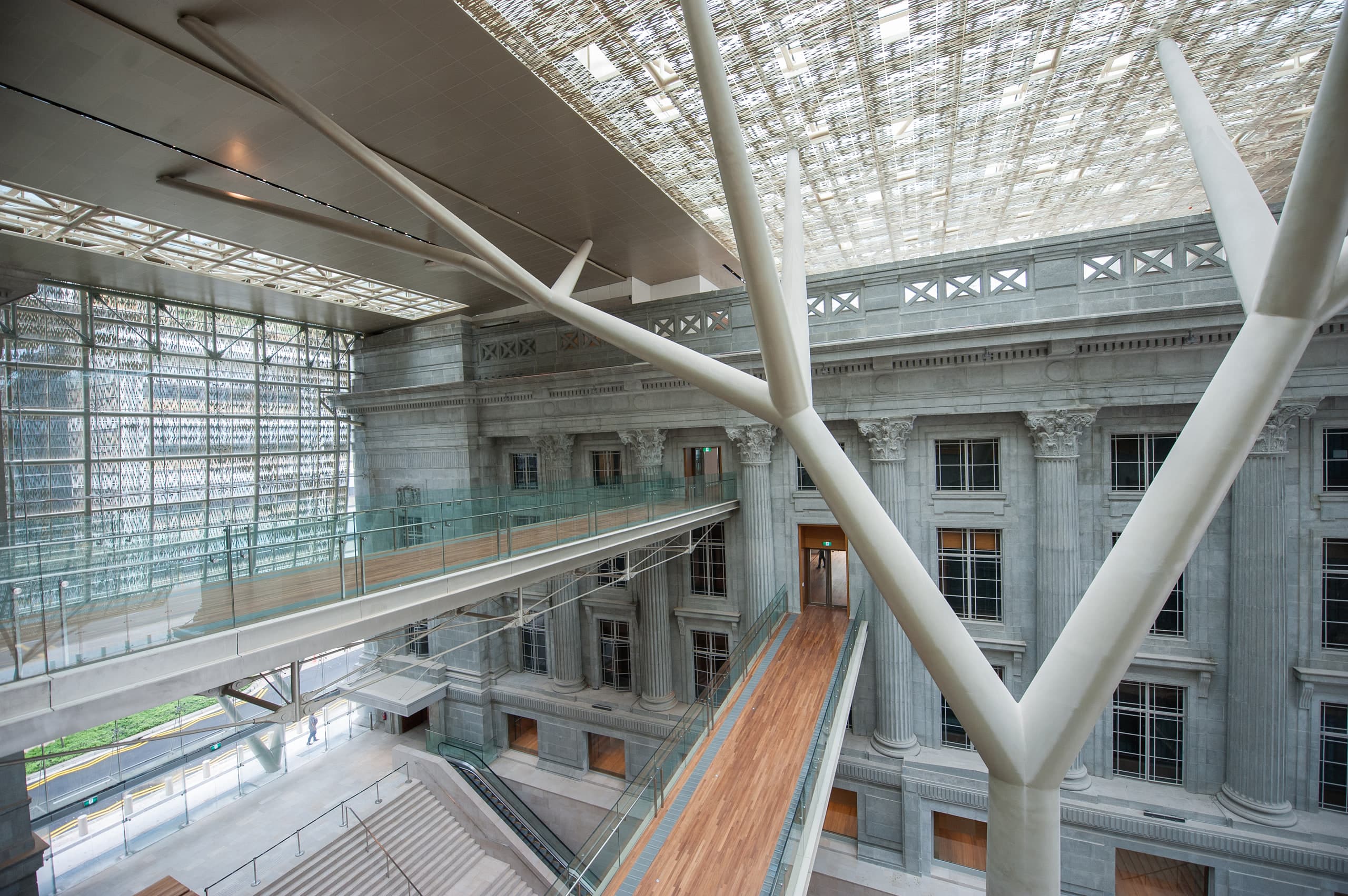 Link bridges and tree-like steel columns under the filigree roof of the Padang Atrium, National Gallery Singapore