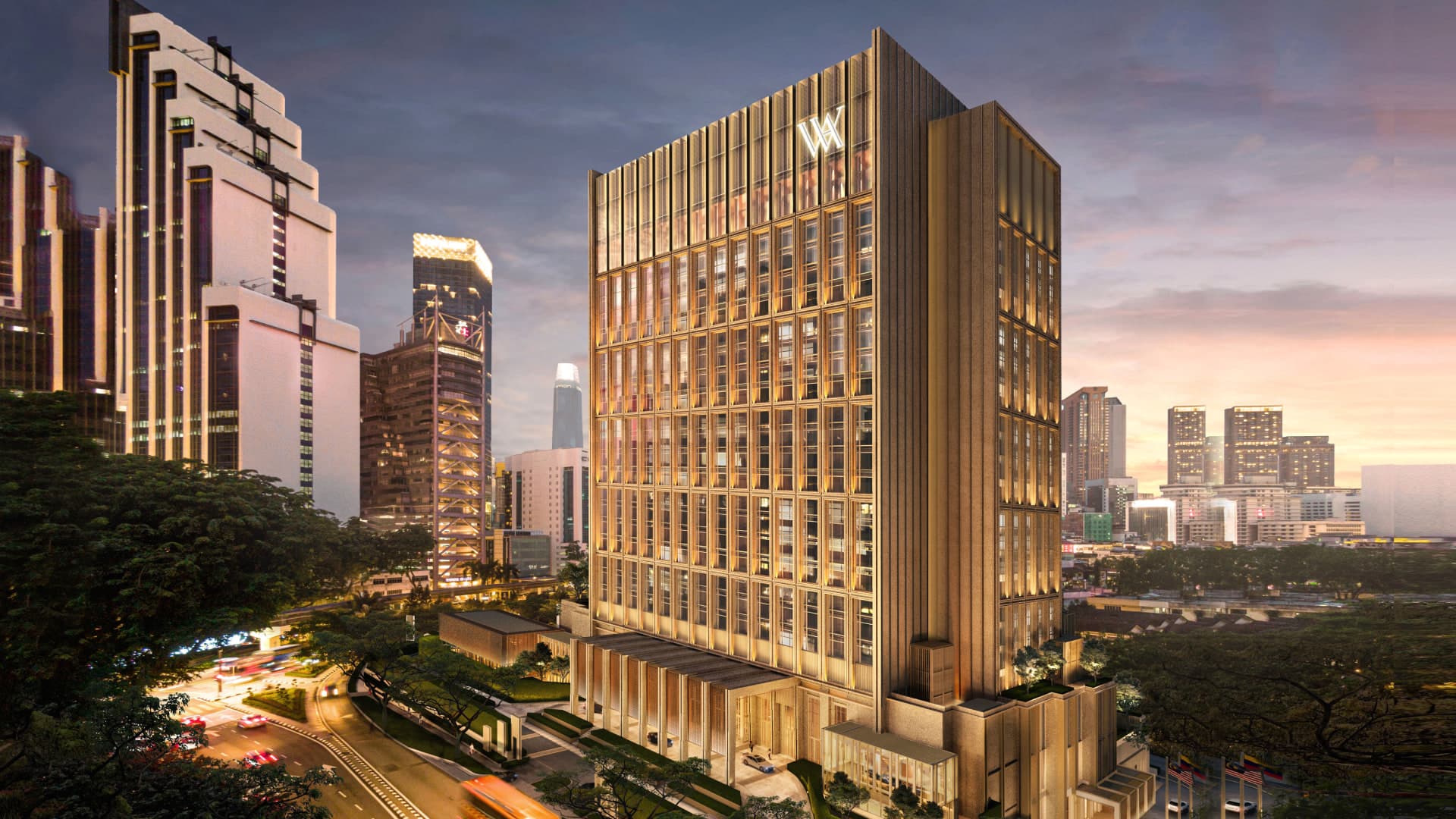 Exterior of Waldorf Astoria Kuala Lumpur on Jalan Raja Chulan with the hotel tower and porte-cochère at dusk