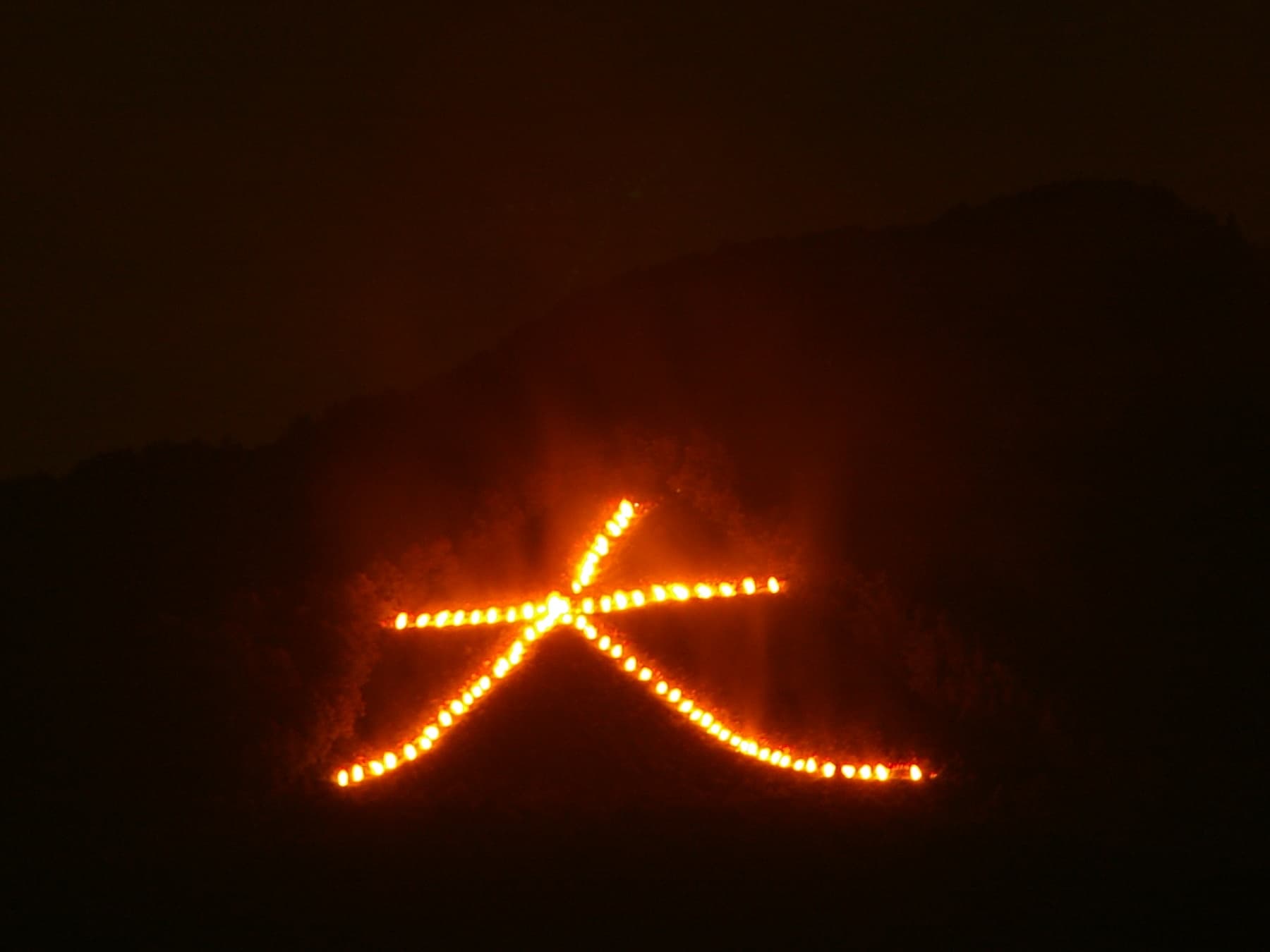 The fire-lit dai character of Gozan no Okuribi on Nyoigatake above Kyoto