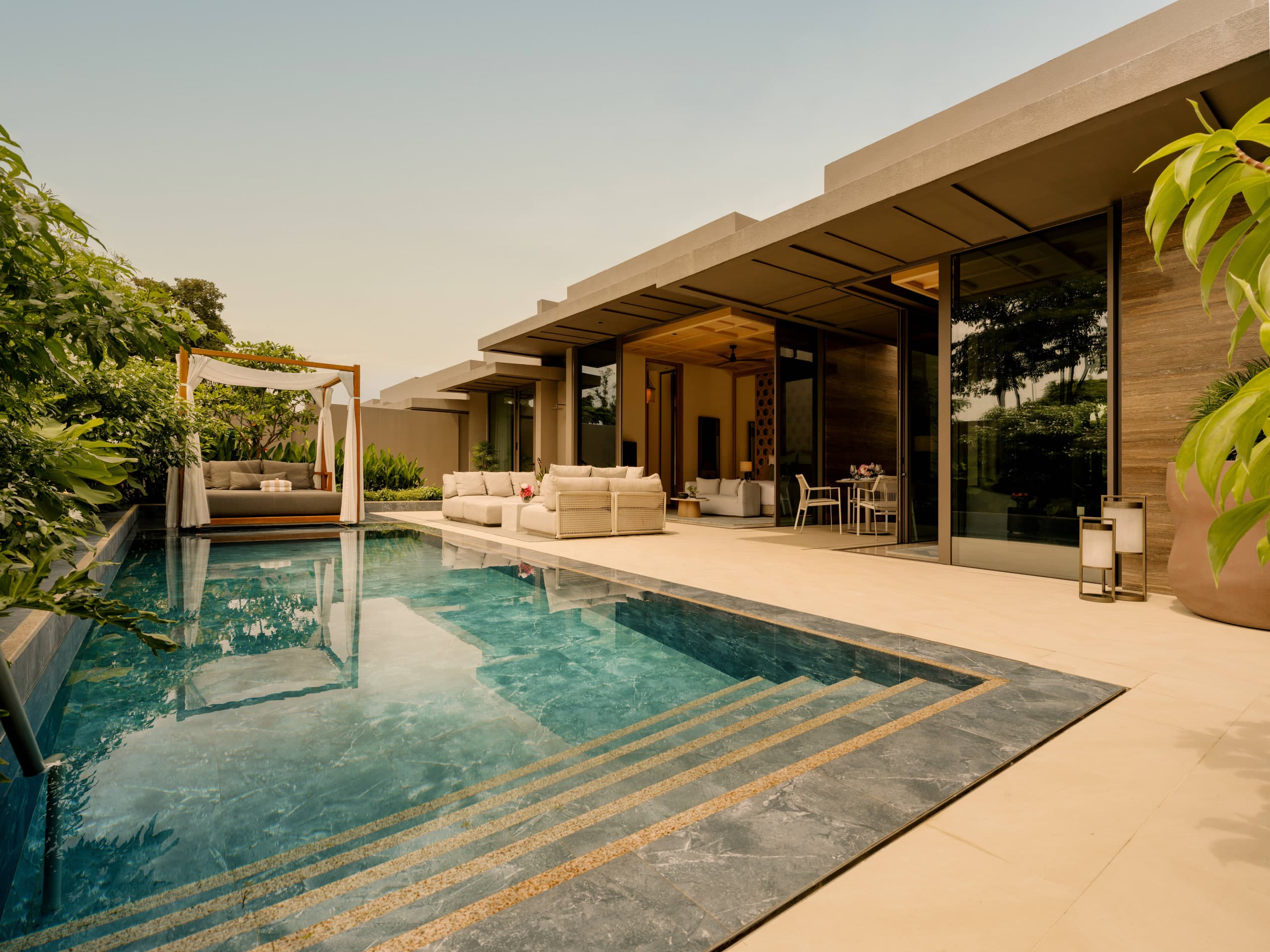 Private pool villa terrace at Raffles Sentosa Singapore at golden hour