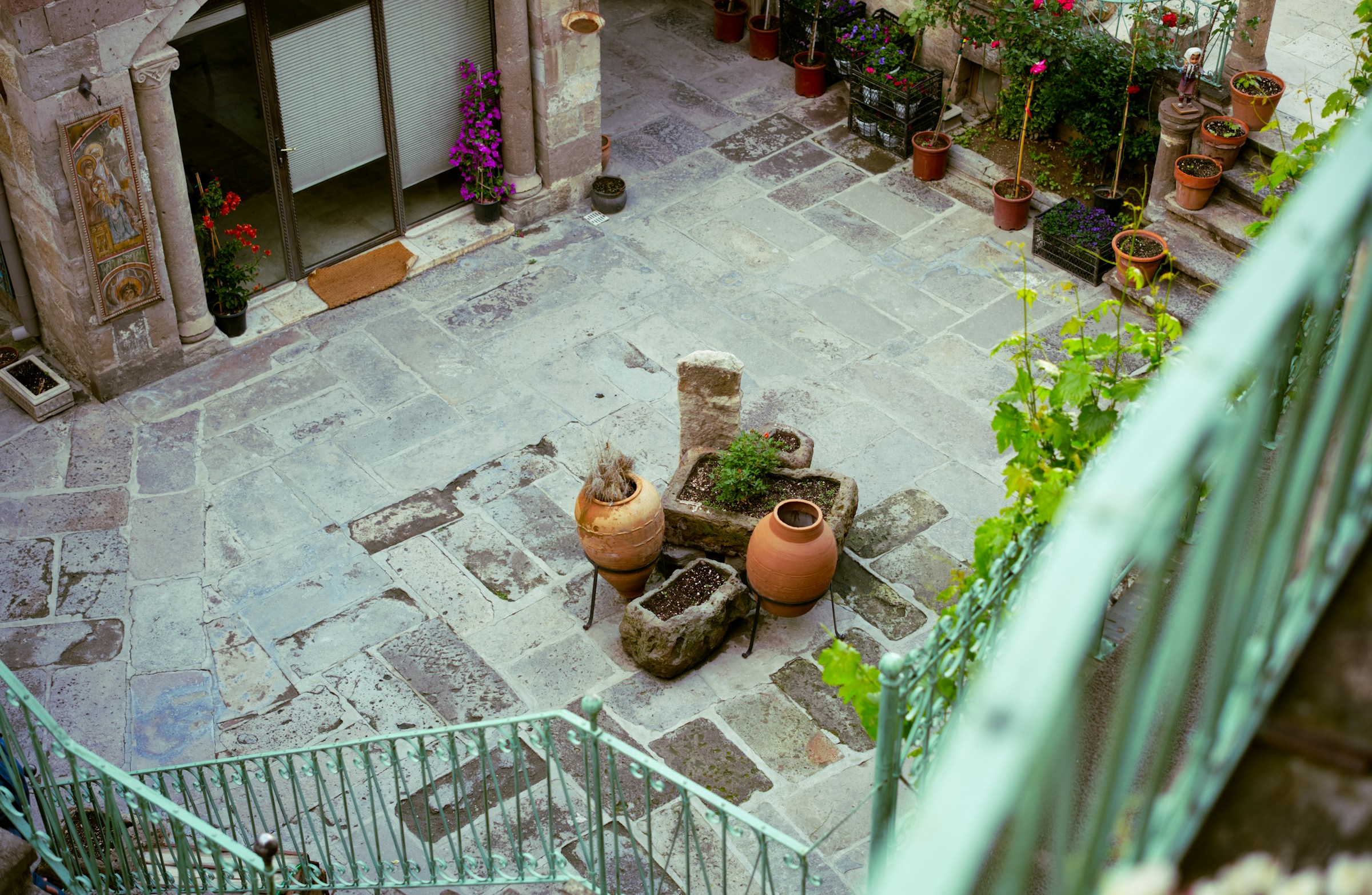 Minimalist courtyard garden with stone and greenery