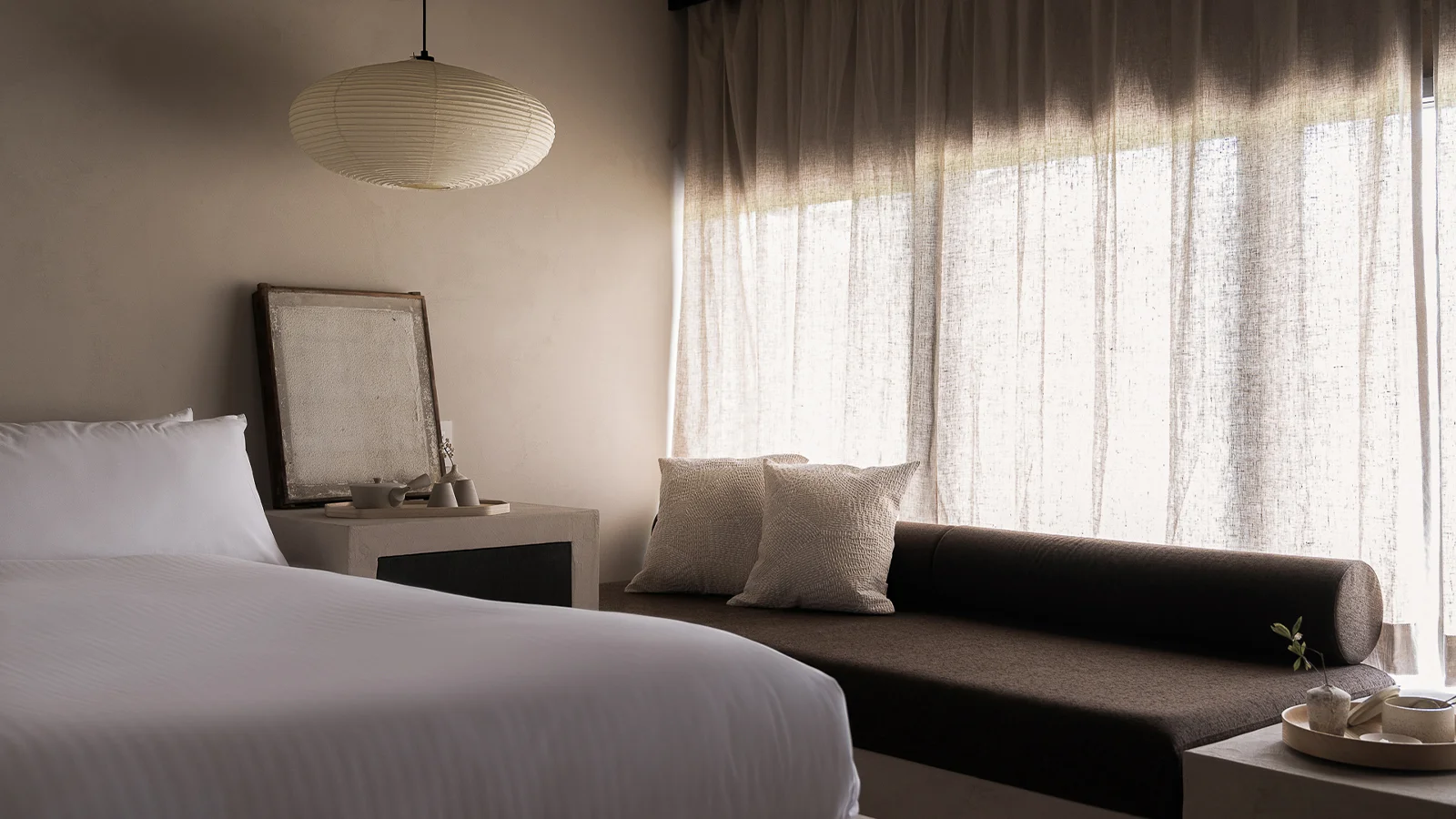 Suite bedroom with washi lantern and linen curtains at Maana Kiyomizu
