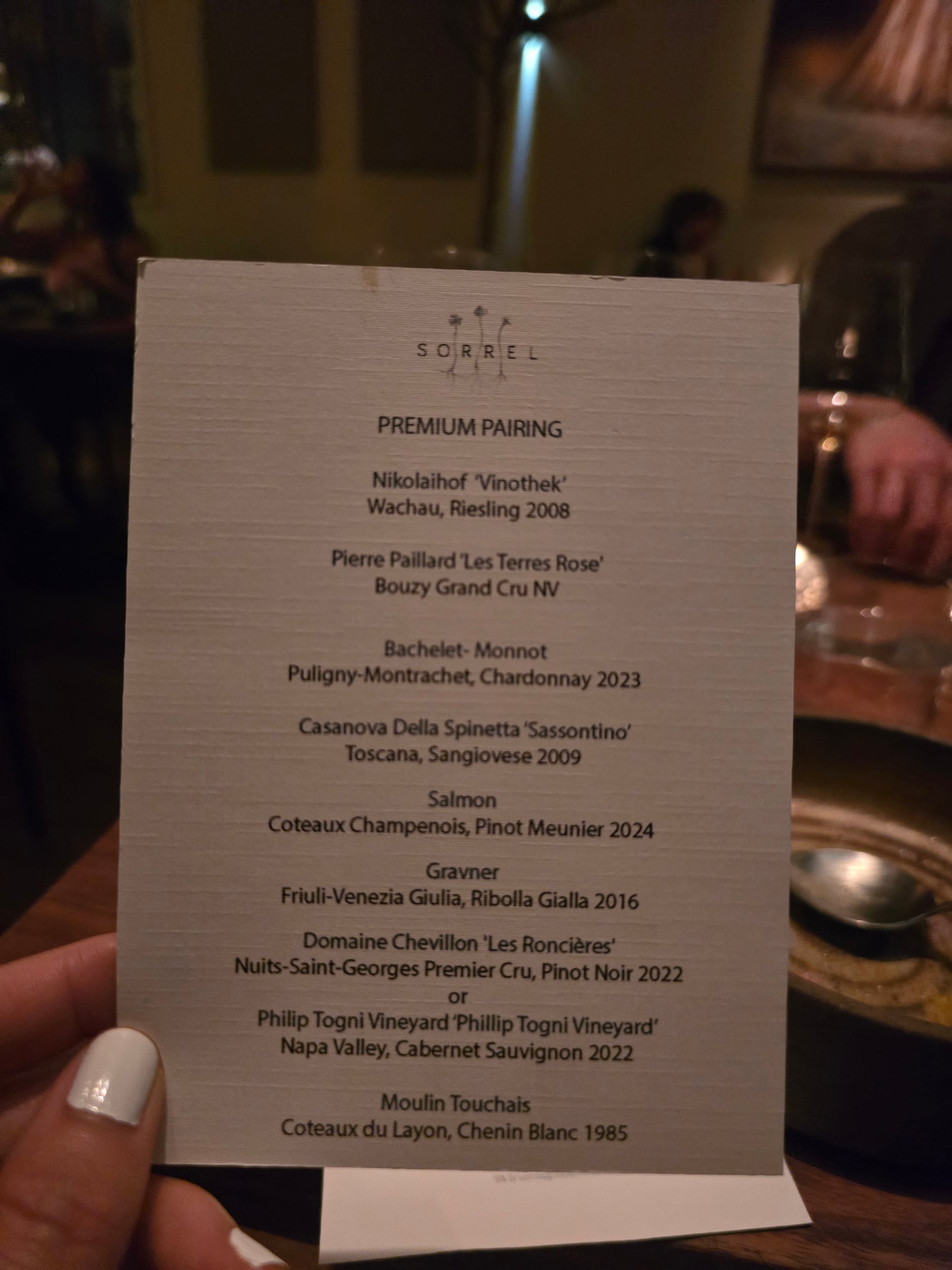 Premium beverage pairing card at Sorrel listing eight pours from Nikolaihof Riesling 2008 to Moulin Touchais Chenin Blanc 1985