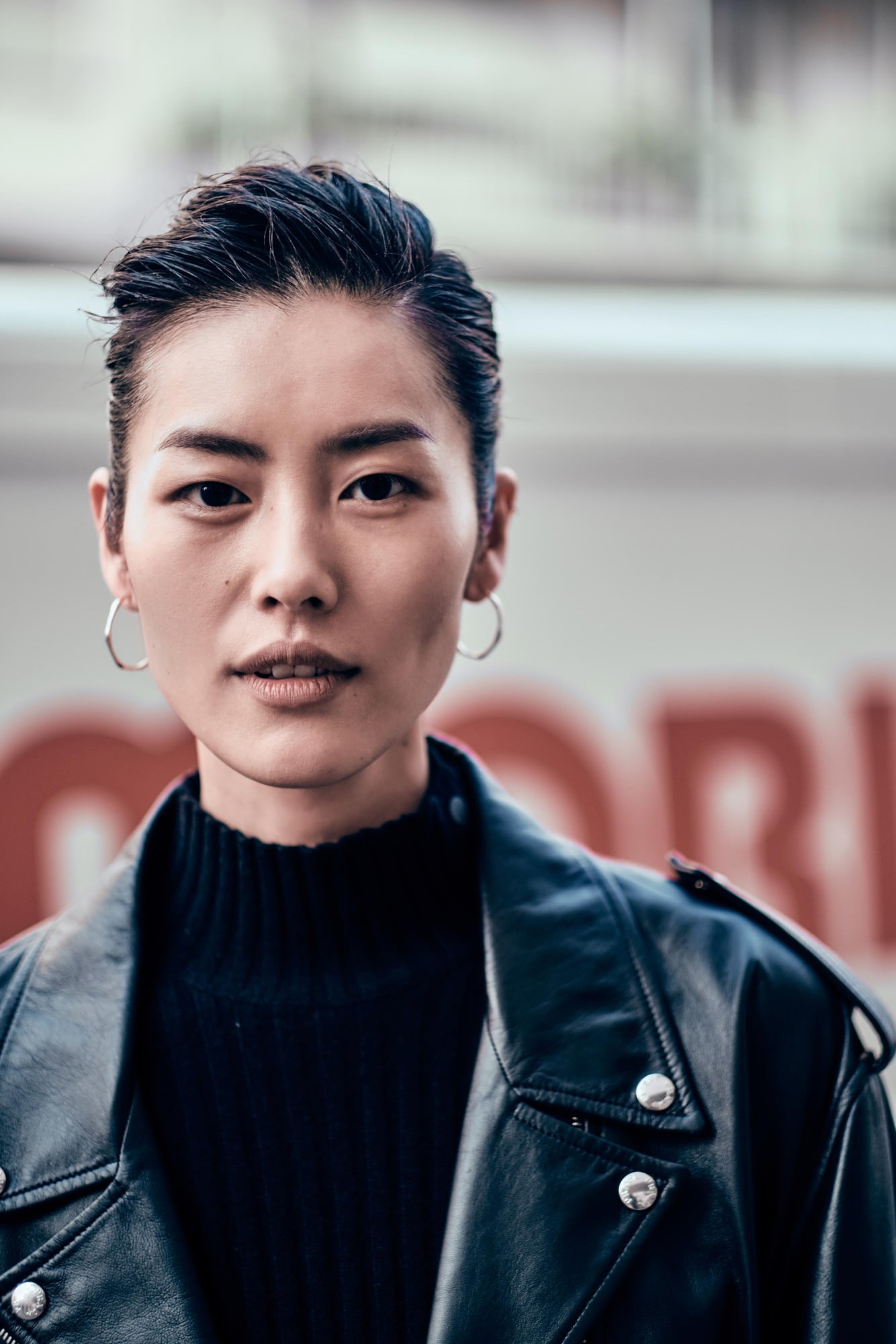 Liu Wen walking at Milan Fashion Week Autumn Winter 2019 in a black lace dress