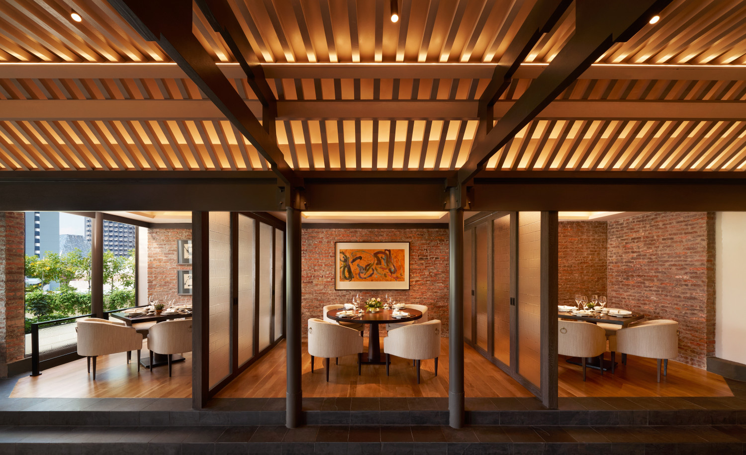 Wood-slat ceiling and brick dining alcoves at Cherry Garden