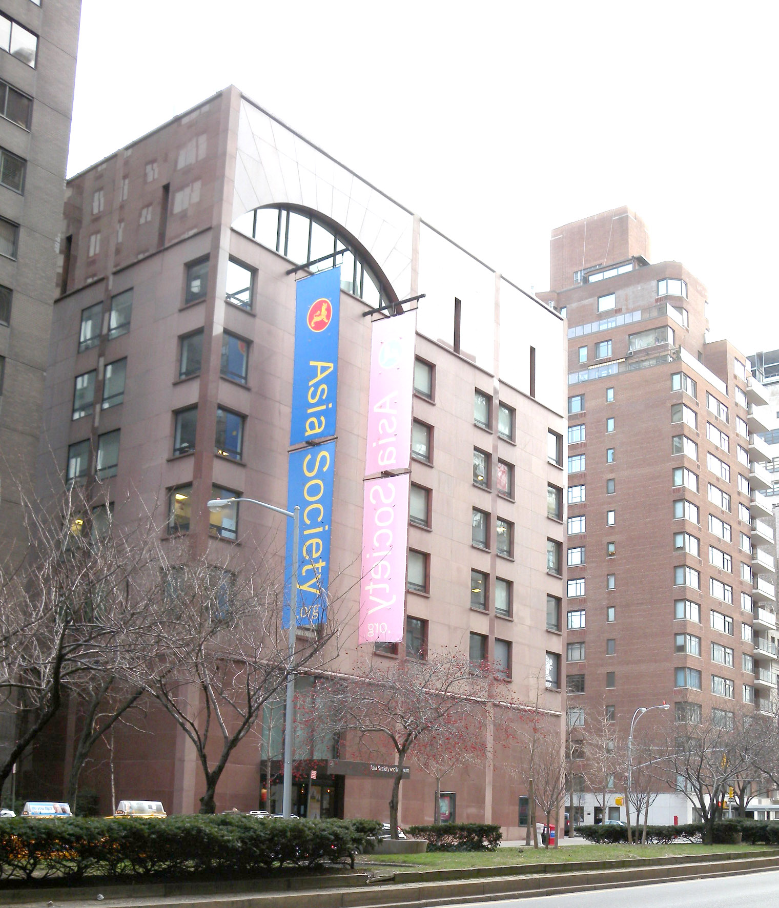Red granite facade of Asia Society at Park Avenue and East 70th Street, Manhattan