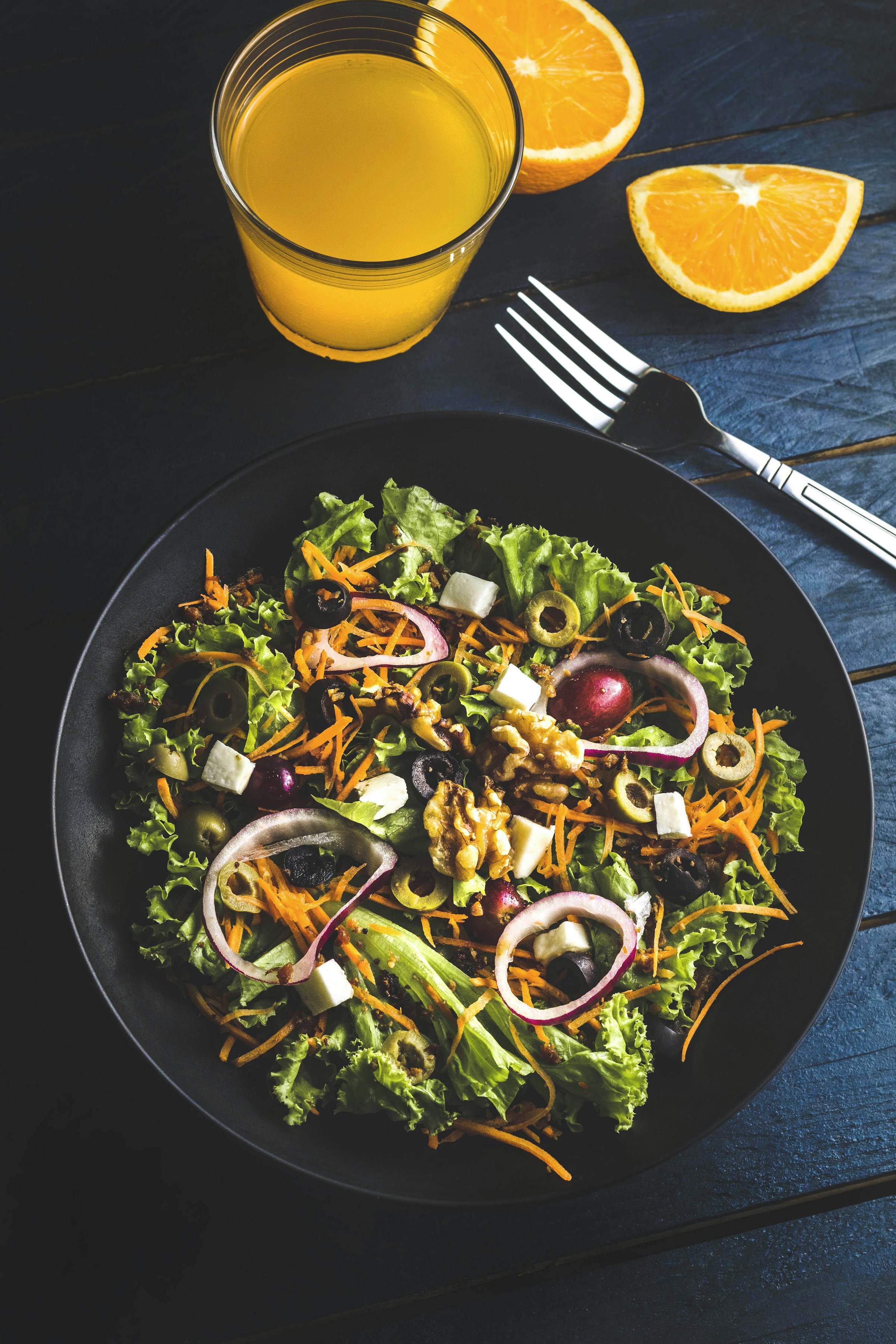 Fresh seasonal salad and ingredients for a shared menu