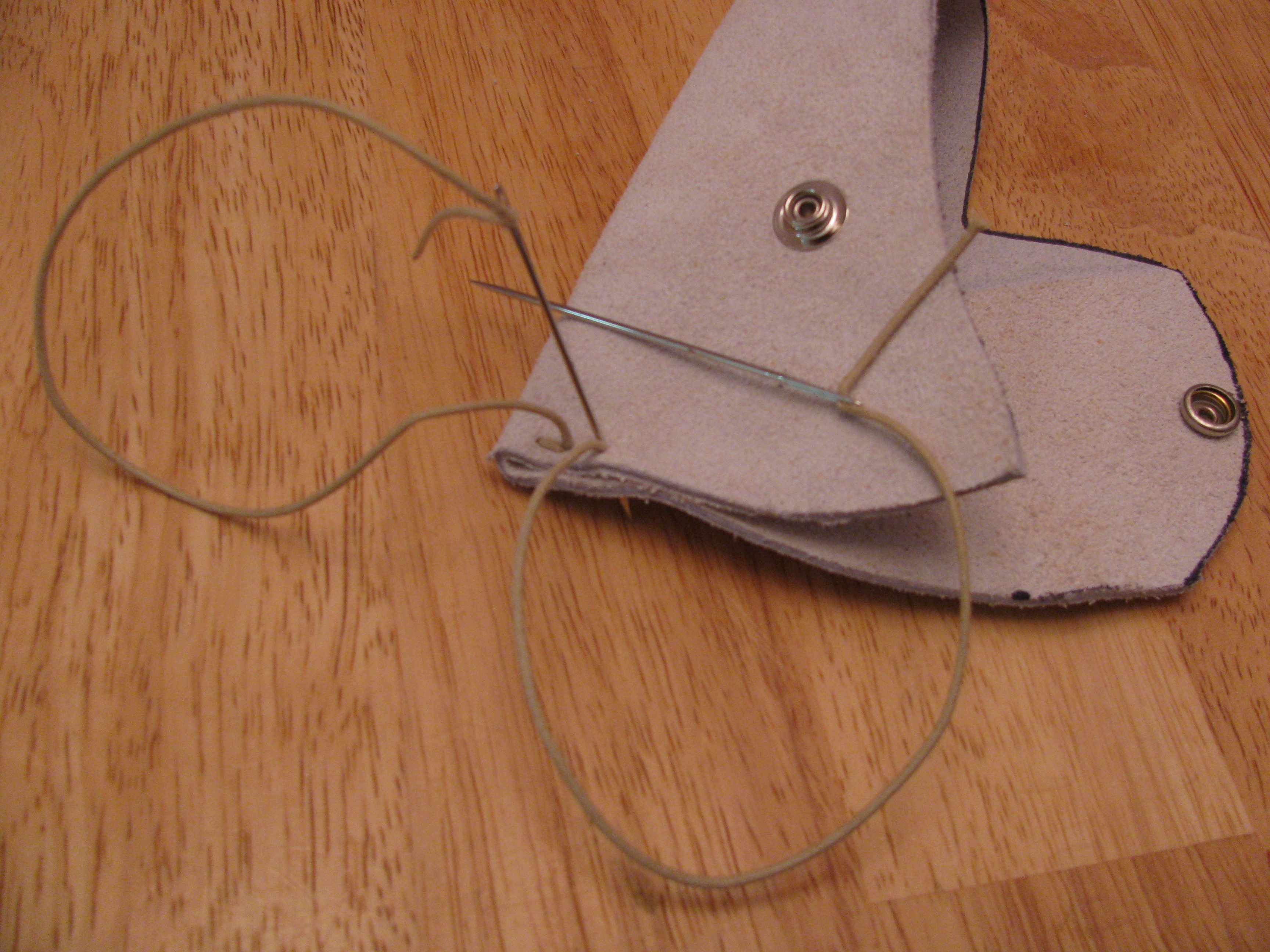 Close-up of saddle stitching on leather