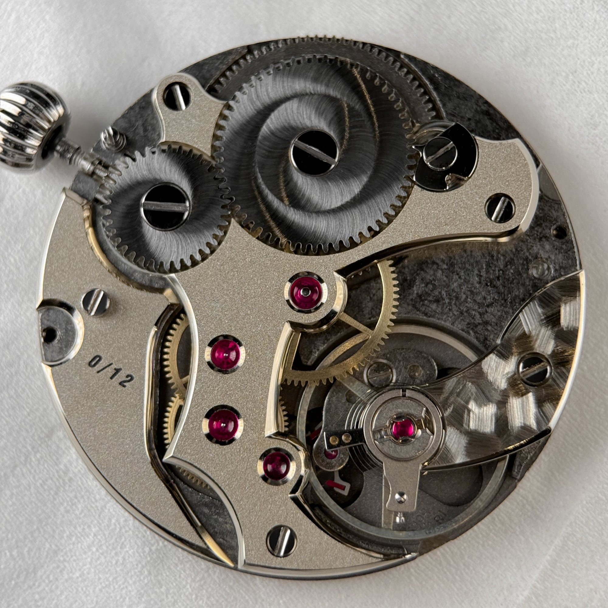 Exhibition caseback of LOTH Watch 1 with frosted German-silver bridges engraved 0 of 12