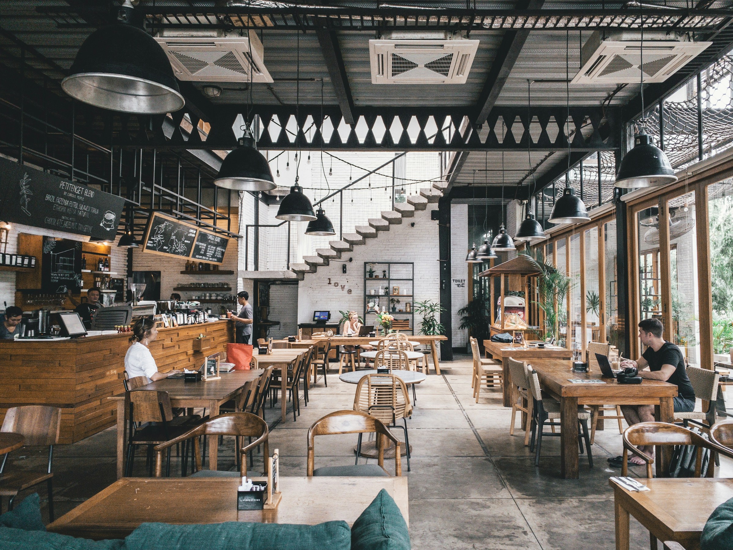 Intimate restaurant counter and communal dining room