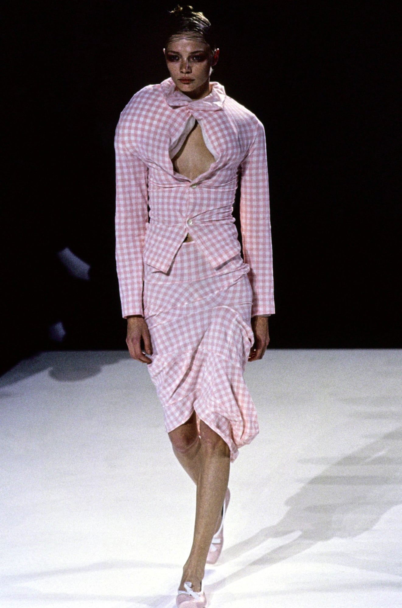 Comme des Garçons spring/summer 1997 runway look in pink and white gingham with padded distortions