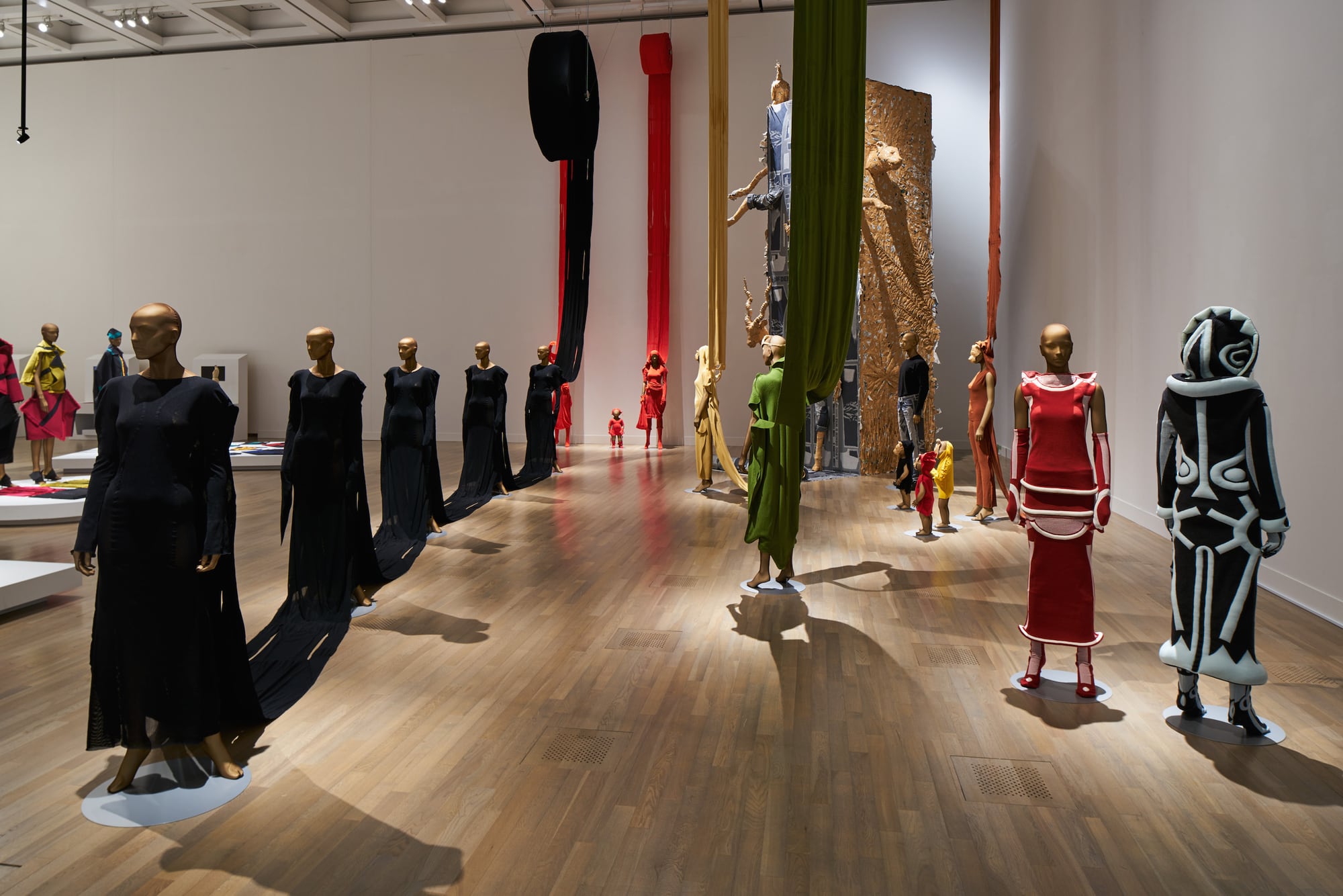 A-POC installation with hanging fabric tubes at the Miyake Issey Exhibition