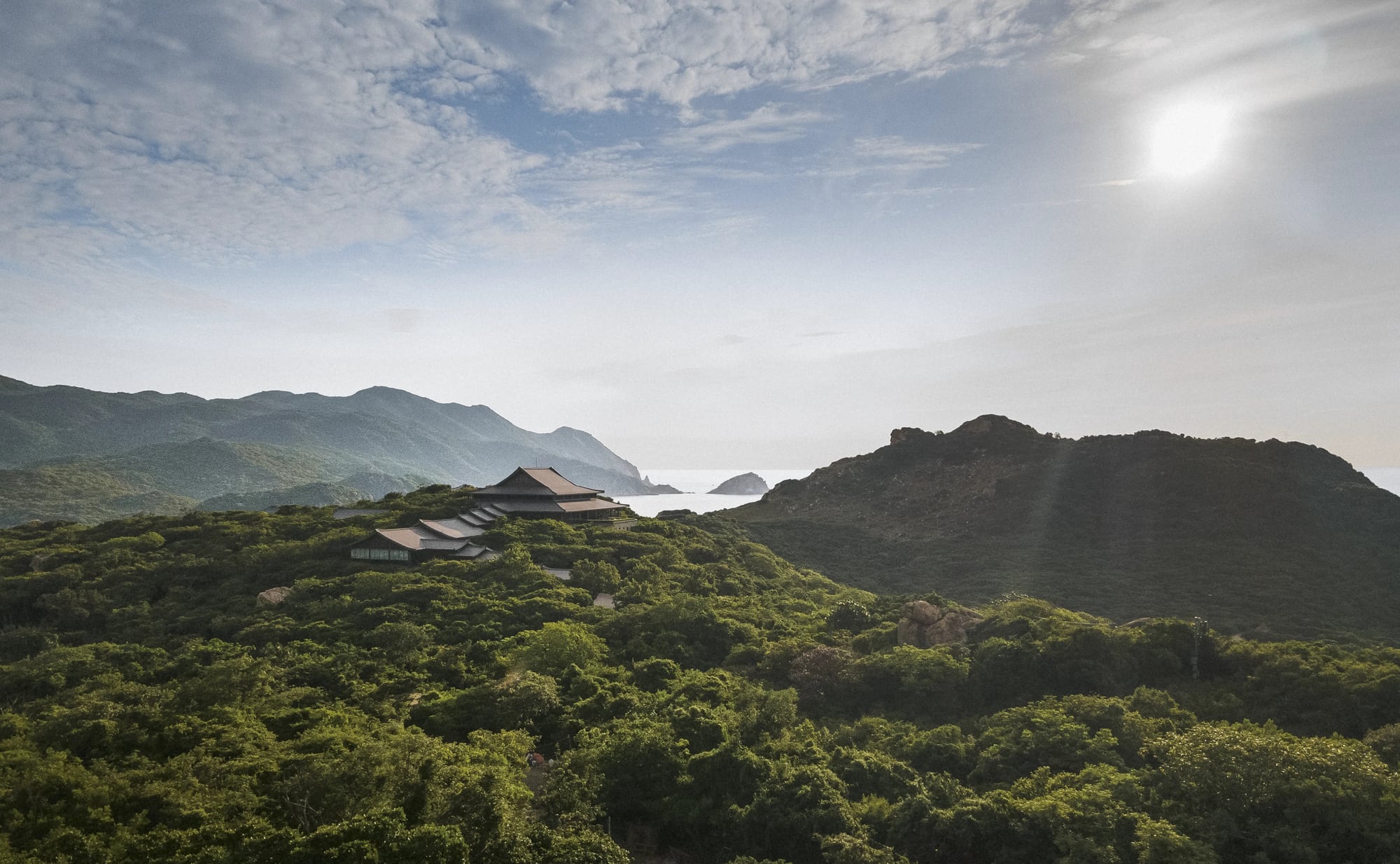 Amanoi pavilion terrace above granite cliffs and turquoise water at Vinh Hy Bay