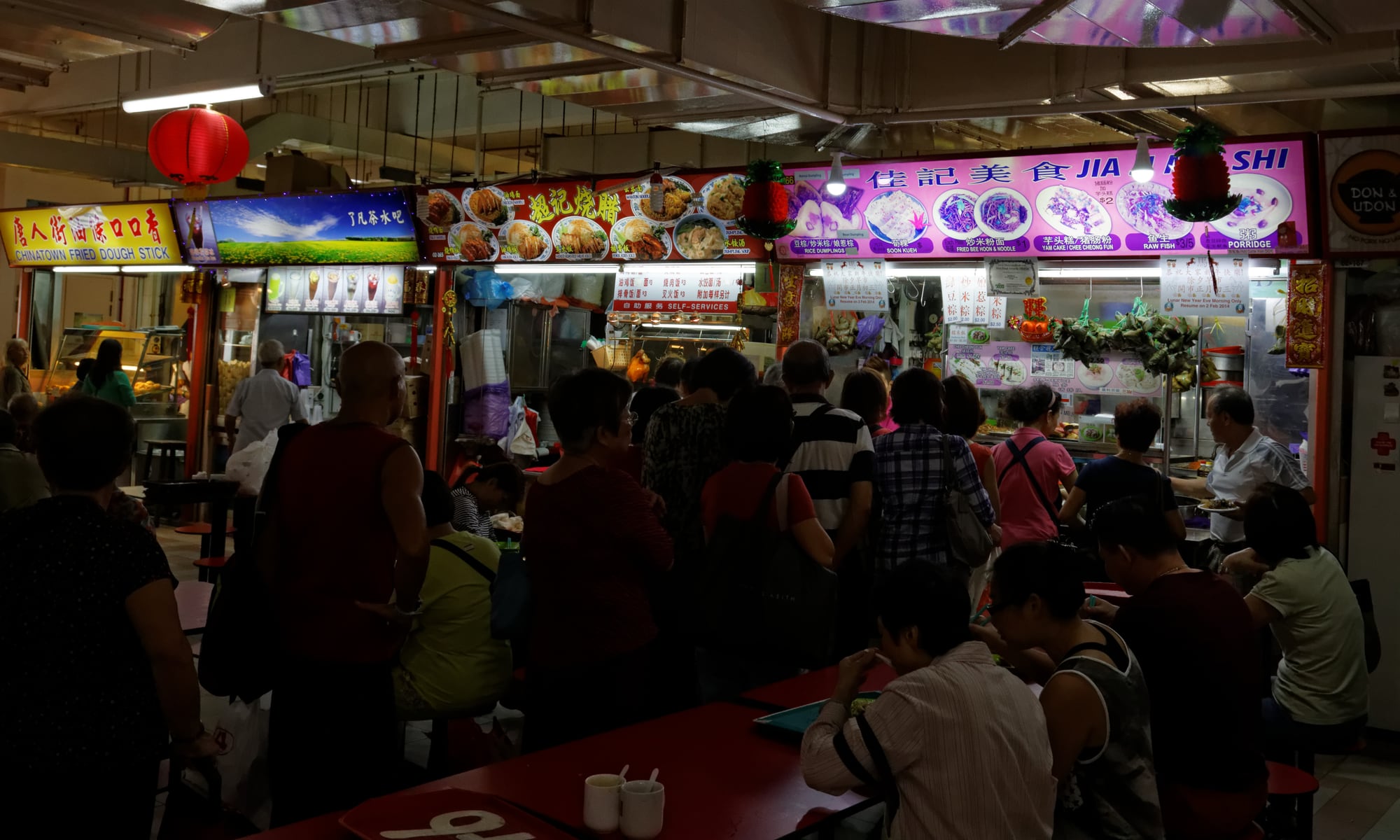 Interior of Chinatown Complex Food Centre with hawker stalls and diners